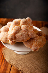 Pan de Muerto. Traditional Mexican sweet bread that is consumed in the season of the day of the dead. It is a main element in the altars and offerings in the festivity of Dia de Muertos in Mexico.