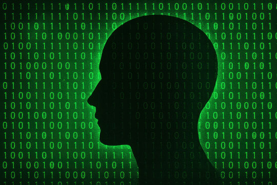 A Silhouette of a Head Against a Digital Backdrop of Green Binary Code, Representing the Intersection of Technology and Human Intelligence - Powered by Adobe