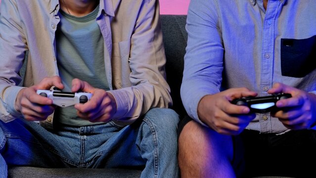 Two People Enthusiastically Playing Video Games Together