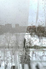 view through a fogged window with water droplets