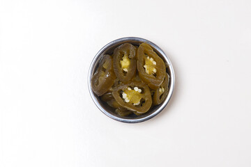 Top view studio shot photo of Pickled Jalapeño Slices in Bowl