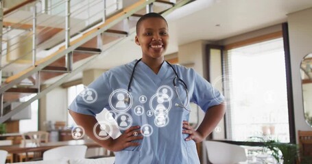 nurse standing in home, network overlay activating profile icons forming patient network - Powered by Adobe