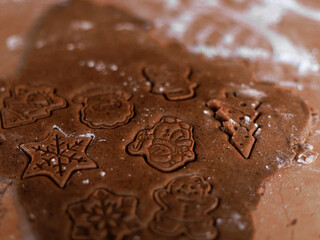 Gingerbread dough with Christmas shapes ready for baking