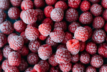 frozen raspberries ice background