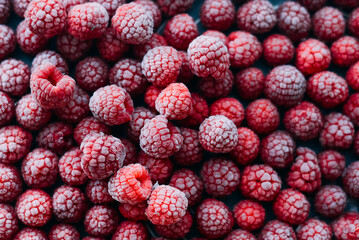 frozen raspberries ice background