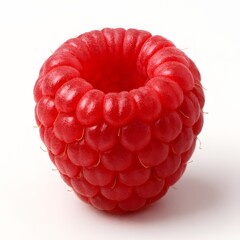 A single, vibrant red raspberry shown in extreme closeup, highlighting its intricate texture and juicy appearance against a clean white background