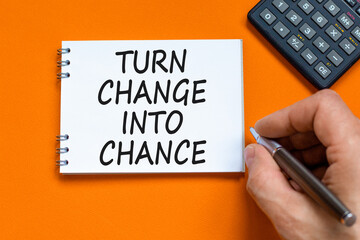 Turn change into chance symbol. Concept words phrase Turn change into chance on beautiful note....