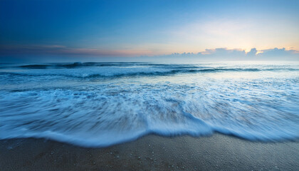Soothing Ocean Waves Caress The Shore At Dawn Serene Calm Blue