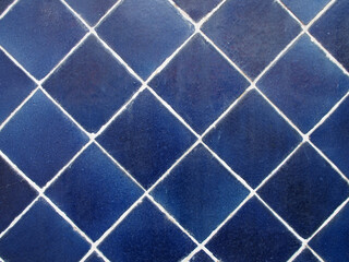 grunge texture blue diamond-shaped ceramic tile with white grout for background