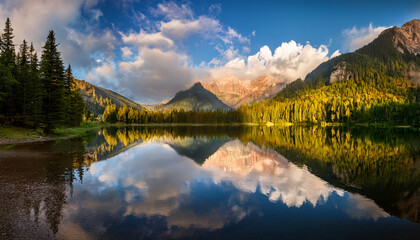 Serene Mountain Lake Reflecting Clouds