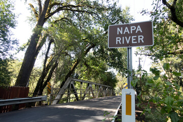 Napa River Sign with Bridge in Rutherford, California