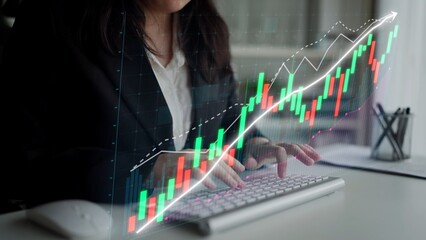 A business professional focuses on stock market analysis using digital graphs and data in a modern office setting, showcasing financial growth and strategy. Copula