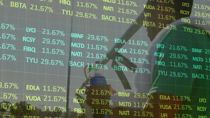 Coworkers talking by facade washer wiping glass warping finance ticker,revealing soccer reflection - Powered by Adobe