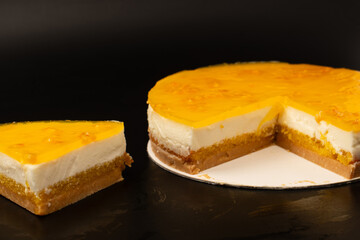 Orange cheesecake isolated on a white background.
