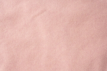 Soft pink cashmere sweater texture background.