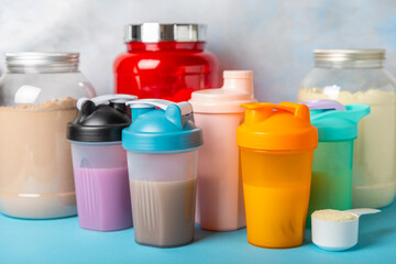 Protein powder. protein shake. Shaker bottle with protein. Food supplement. Whey protein powder with shaker for mixing. Sports nutrition. Concept of sports and healthy lifestyle. Sports equipment