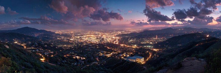Panoramic view of a city nestled in a valley at twilight