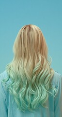Naklejka premium Woman's back view, light blonde/mint green ombre hair