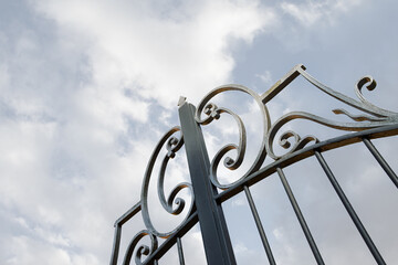 Entrance of a French winery on a cloudy sky