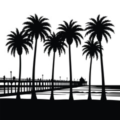 Silhouette of palm trees and a pier on a beach at sunset