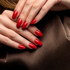 Elegant Oval-Shaped Brown Gel Nail Polish Manicure on Pink Background