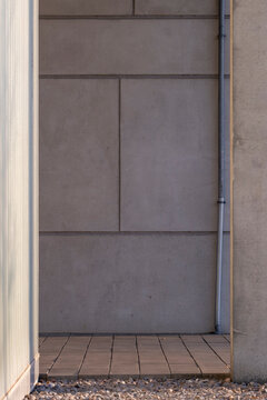 Minimal concrete wall detail in contemporary architecture, emphasizing surface, texture and materiality for abstract design and backgrounds
