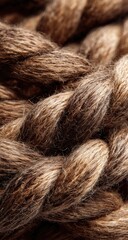 Close-up view of tightly interwoven, light brown and tan ropes
