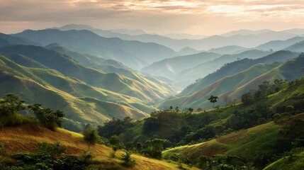 Obraz premium A tranquil vista of rolling hills and misty mountains, showcasing a serene landscape bathed in soft light.