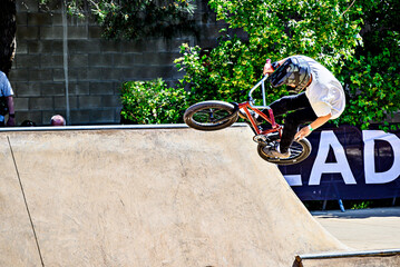 Young man practicing BMX at the new skate park in Igualada Central Park, Barcelona, ​​Spain.