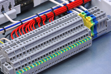 Electrical screw terminals for connecting wires in an electrical switchboard. Soft focus. Close-up.