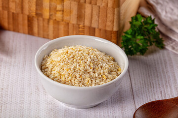 Raw dry sesame seeds heap
