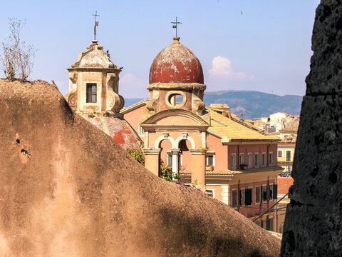Corfu island old town. Greece. Church bell Tower on blue sky, Monastery of Panagia Tenedos.