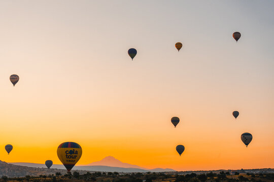 Colorful hot air balloon flying over Cappadocia, Turkey.