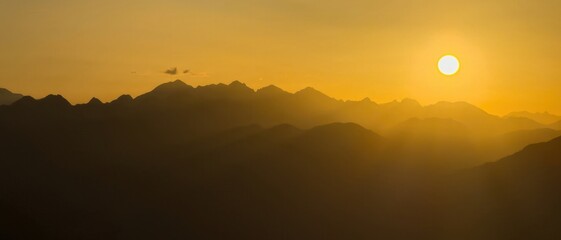 Pyrenees mountains during golden hour sunset creating stunning vista.