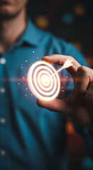 Man in a blue shirt holding a glowing target with an arrow hitting the bullseye dartboard