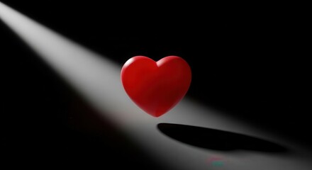 Floating Red Heart Illuminated by Spotlight on Black Background