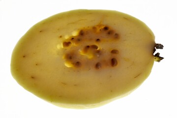 Close-up of a guava slice showing the seeds and interior structure