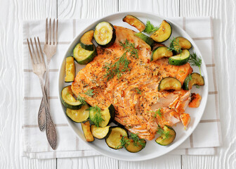 freshly baked salmon fillet with zucchini and dill