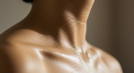Fototapeta premium Sweaty Neck and Shoulders with Visible Water Droplets in Soft Light