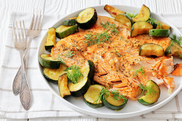 freshly baked salmon fillet with zucchini and dill