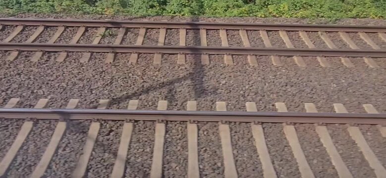 Two parallel railway tracks with gravel bedding and surrounding vegetation. The track runs between Bremen and Hamburg, Germany.