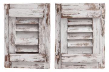 Pair of old weathered white wooden window shutters isolated.