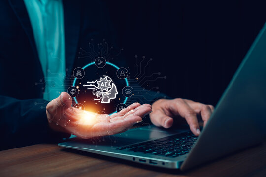Businessman using laptop with holographic AI interface show automation and data icons. Concept artificial intelligence, machine learning, digital innovation, business analytics and future technology.