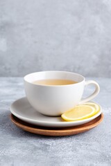 Obraz premium Steaming chamomile tea with lemon slice, serene hygge morning ritual, calming brew for mindfulness, observance of Quiet Day