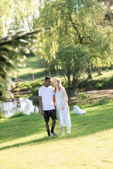Fototapeta premium Romantic Interracial Couple Outdoors in Summer