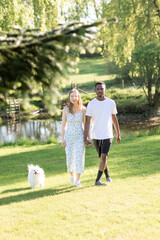 Fototapeta premium Romantic Interracial Couple Outdoors in Summer