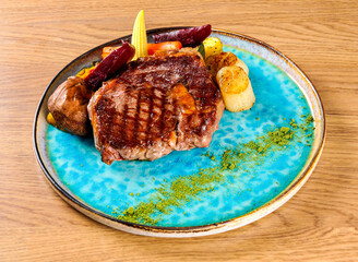 Grilled Angus Rib Eye Steak with Roasted Potatoes and Black Pepper Sauce on plate top view of Hong Kong food