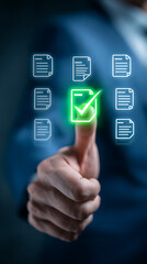 Businessman touching a digital document with a green checkmark and other documents checklist approval