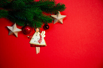 Elegant top view Christmas decorations arranged on a vibrant red background, conveying warmth and holiday cheer, copy space for text