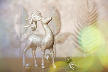 Elegant Christmas decorations on a silver background, conveying warmth and holiday cheer, card with Christmas deer